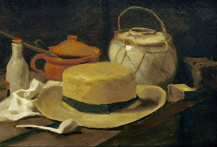 Stillleben mit gelbem Strohhut