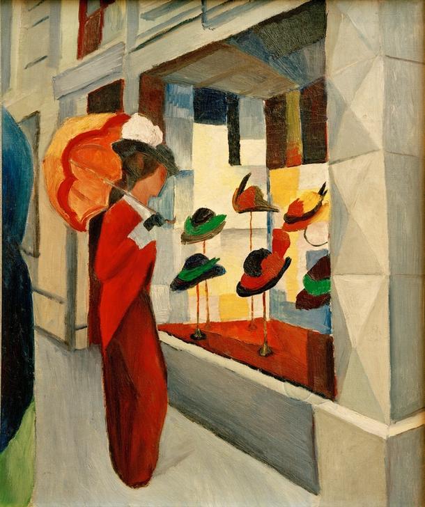 Gemälde 'Hutladen' von August Macke: Expressionistische Darstellung einer Frau, die zwischen einer Vielzahl von Hüten in einem Hutladen steht, umgeben von kräftigen Farben und geometrischen Formen.