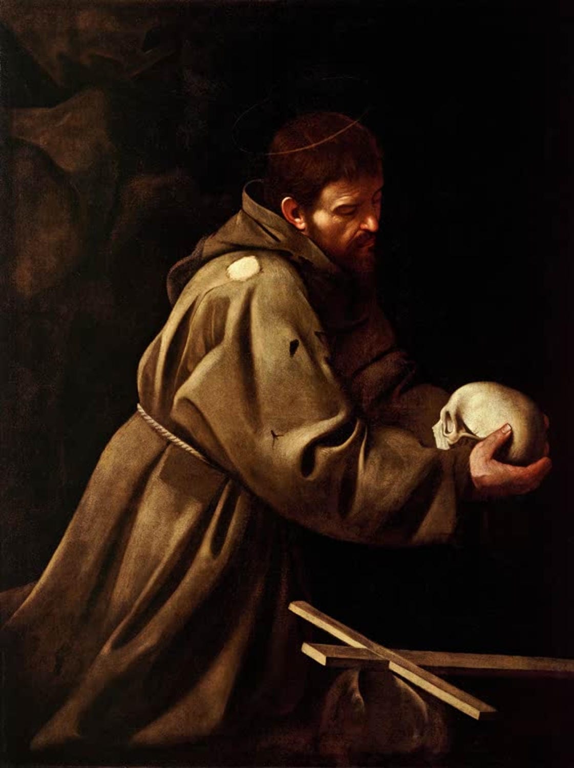 Franz von Assisi von Michelangelo Caravaggio – barockes Gemälde des Heiligen in stiller Kontemplation mit starkem Hell-Dunkel-Kontrast
