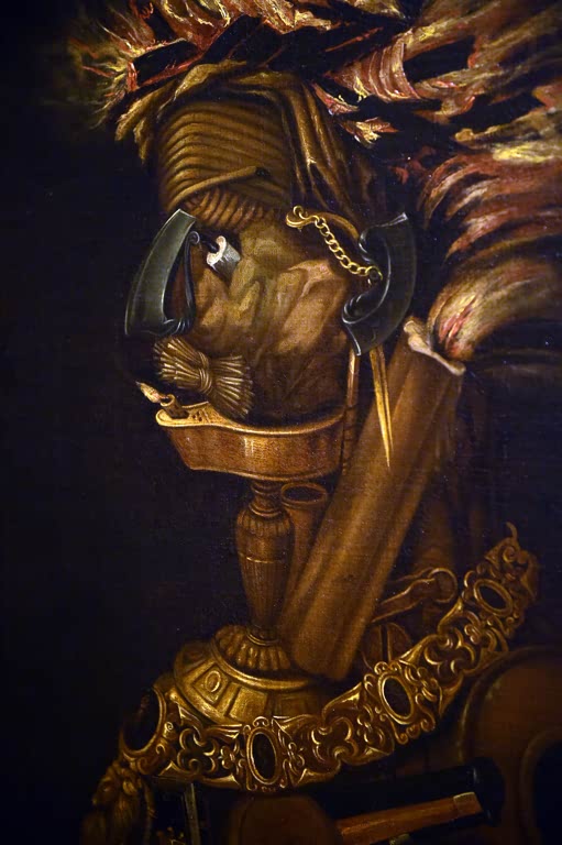 Kunstdruck „Das Feuer“ von Giuseppe Arcimboldo mit einer aus Flammen, Kerzen und Feuerwaffen zusammengesetzten Figur