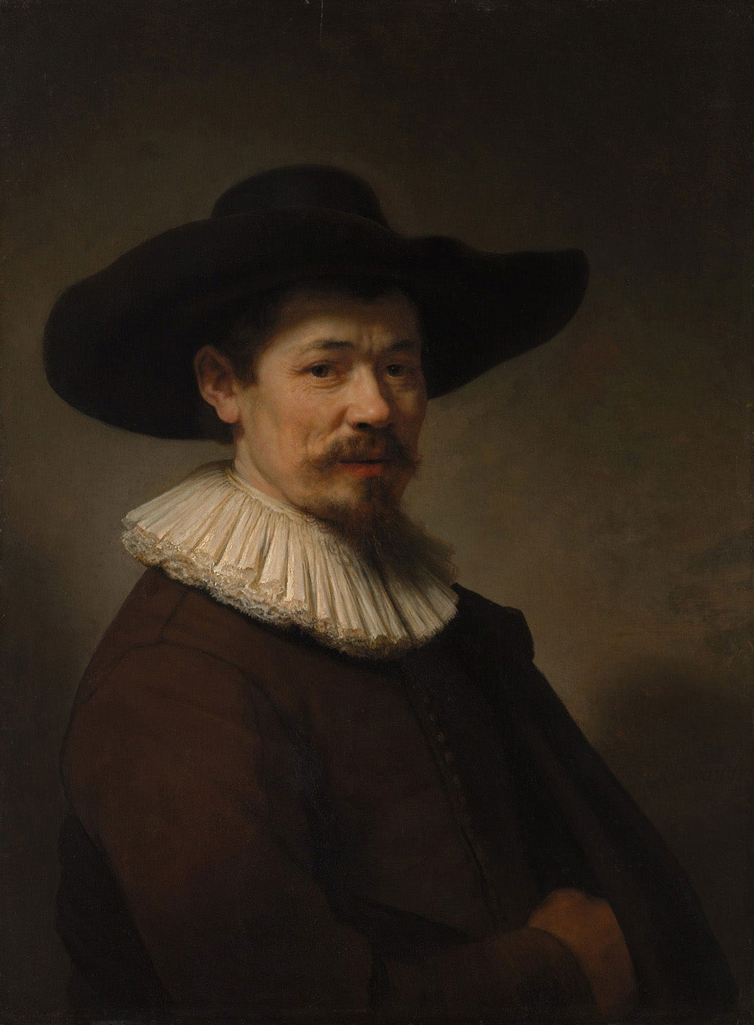 Porträt eines Mannes mit dunkler Kleidung und weißem Kragen, gemalt in Öl auf Holz, detailreiche Darstellung mit starkem Licht-Schatten-Kontrast, charakteristisch für Rembrandts Stil.