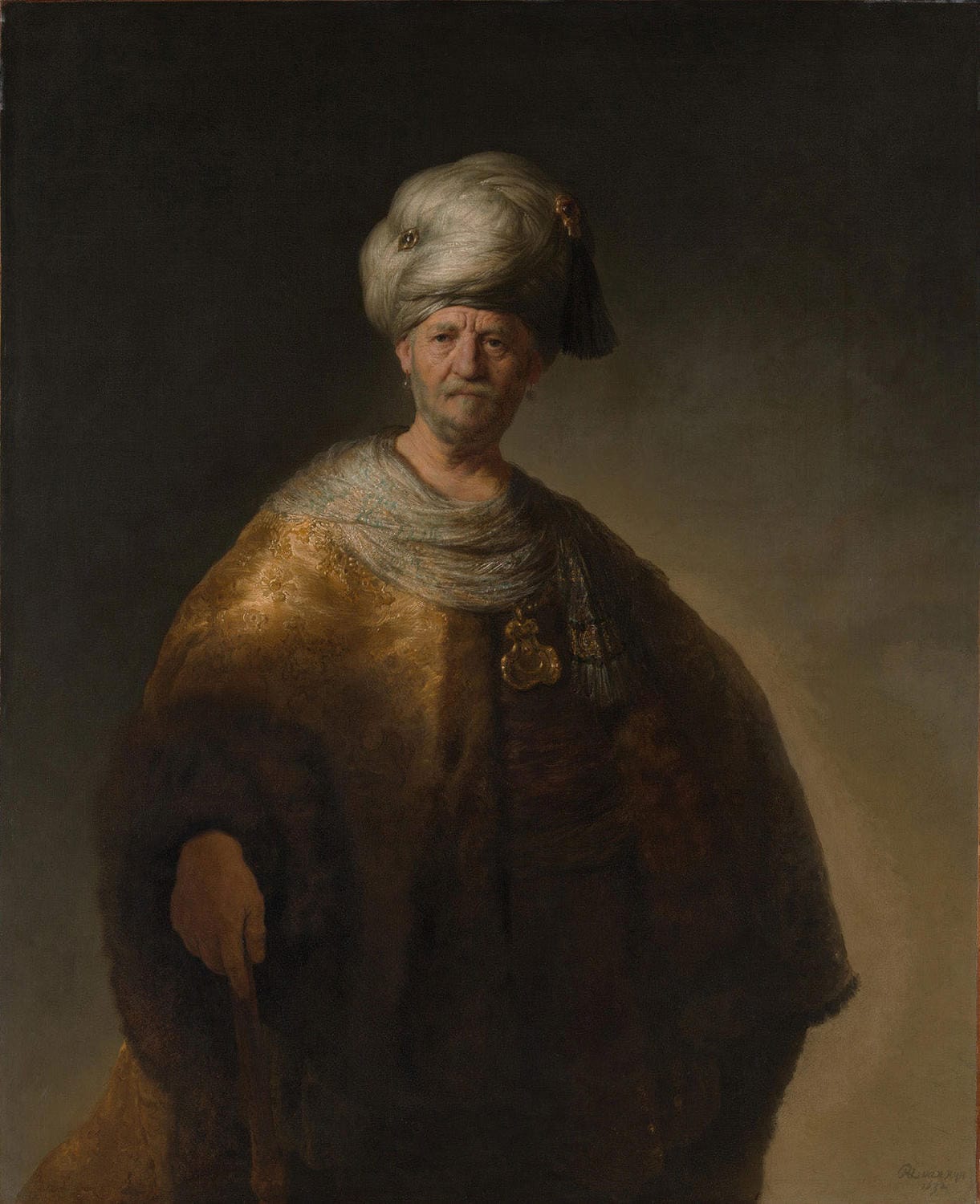 Porträt eines Mannes mit Turban, gemalt von Rembrandt van Rijn, mit warmen Brauntönen, goldenen Akzenten und eindrucksvollem Licht-Schatten-Spiel, charakteristisch für die Barockzeit.