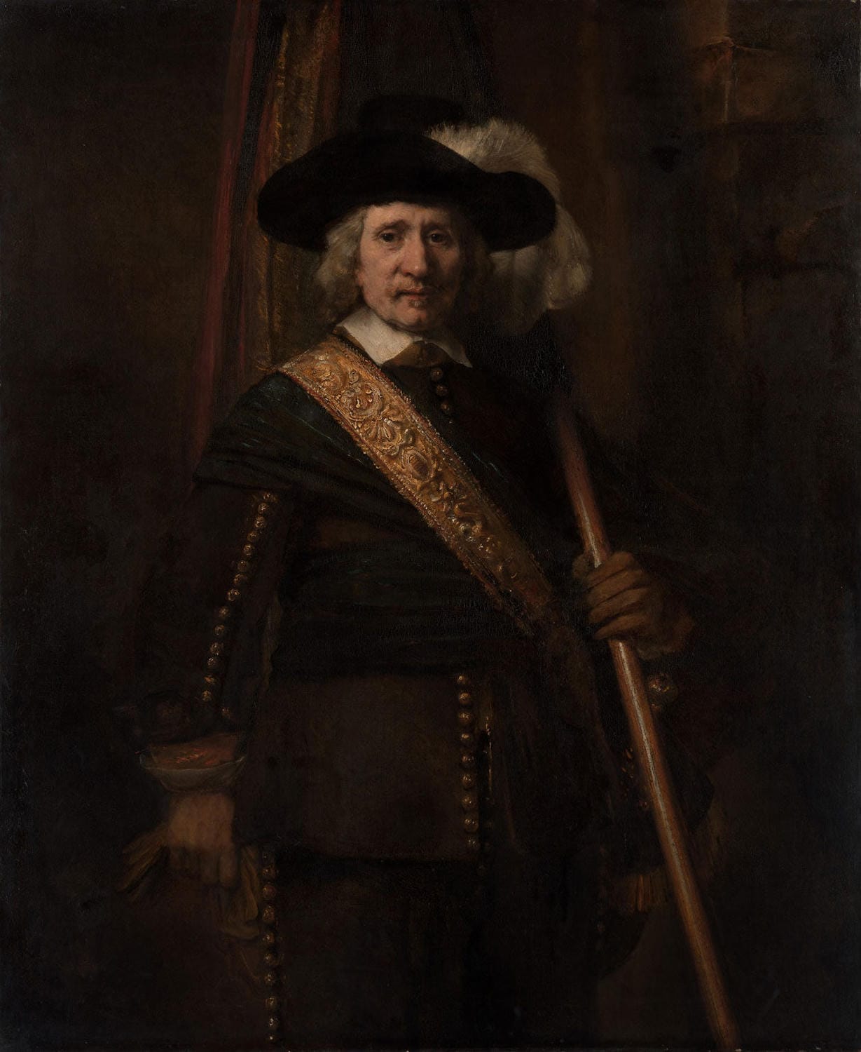 Der Standartenträger, gemalt von Rembrandt van Rijn, zeigt einen Soldaten in Rüstung mit Standarte, hervorgehoben durch lebendige Farben und dramatisches Licht-Schatten-Spiel.