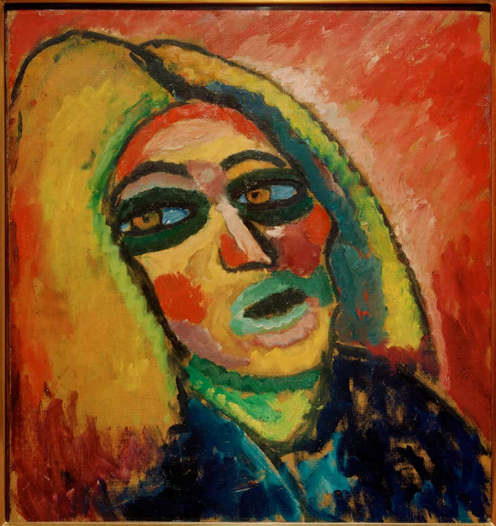 Frau mit gelbem Haar, grünen Lippen und buntem Gesicht vor rotem Grund – Alexej von Jawlensky Kopf Kunstkopie