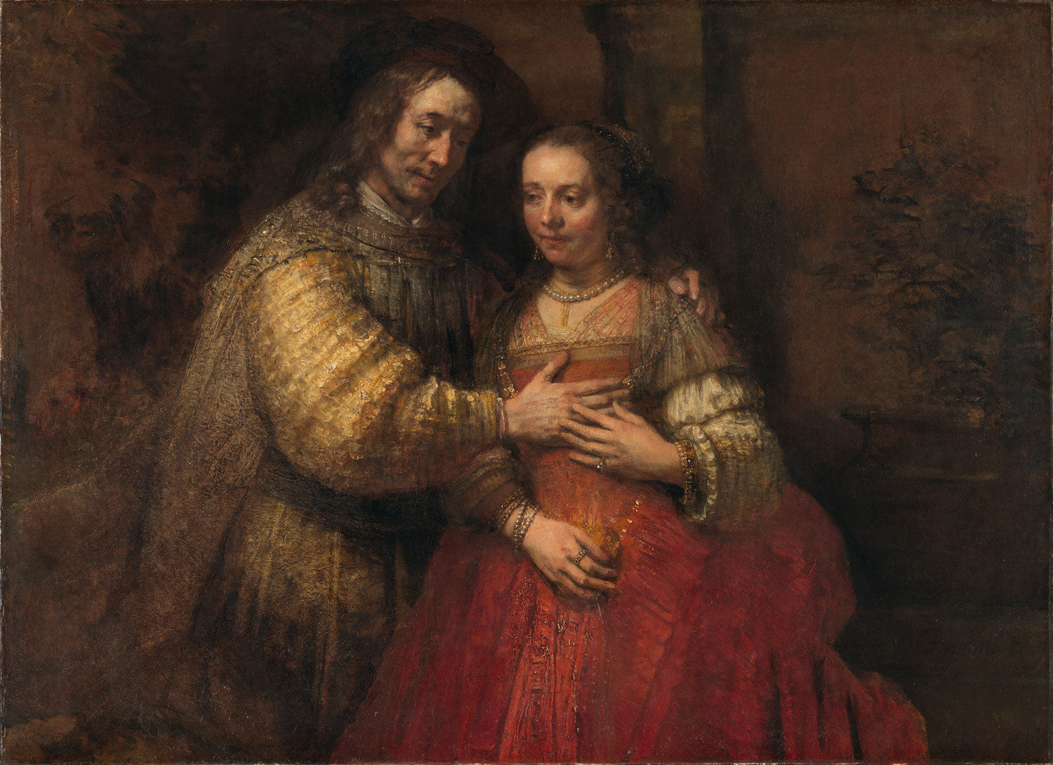Ein biblisches Paar, Isaac und Rebecca, in einem innigen Moment der Zuneigung. Rebecca trägt ein tiefrotes Gewand und ist sanft in Isaacs Armen gehalten. 