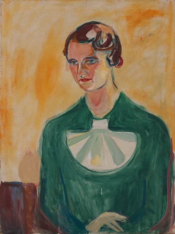 Frau mit rotbraunem Haar in grünem Kleid vor orangegelbem Grund – Edvard Munch Annie Stenersen Kunstkopie