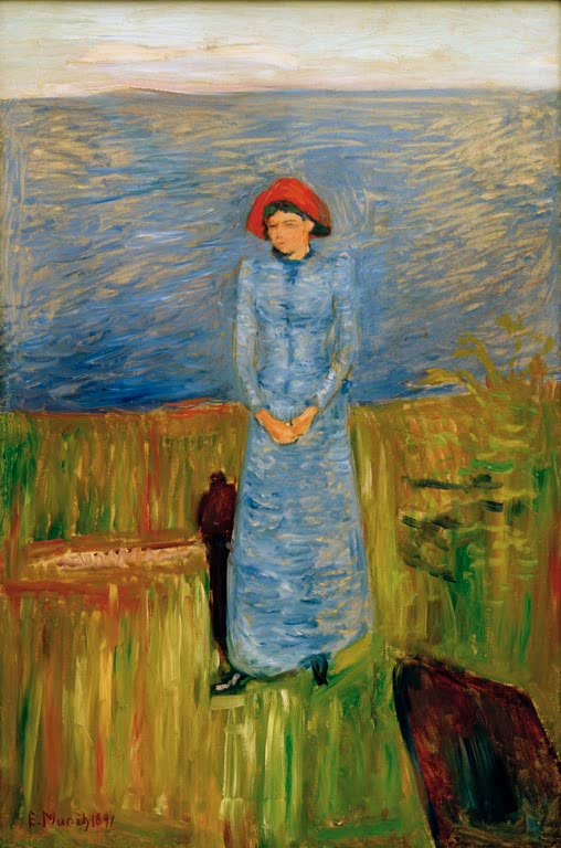 Frau in blauem Kleid und rotem Hut steht auf einer Wiese am Fjord – Edvard Munch Frau mit rotem Hut beim Fjord Kunstkopie
