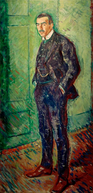 Stehender Mann im dunklen Anzug mit Händen in den Taschen vor grüner Tür – Edvard Munch Jappe Nilssen Kunstkopie