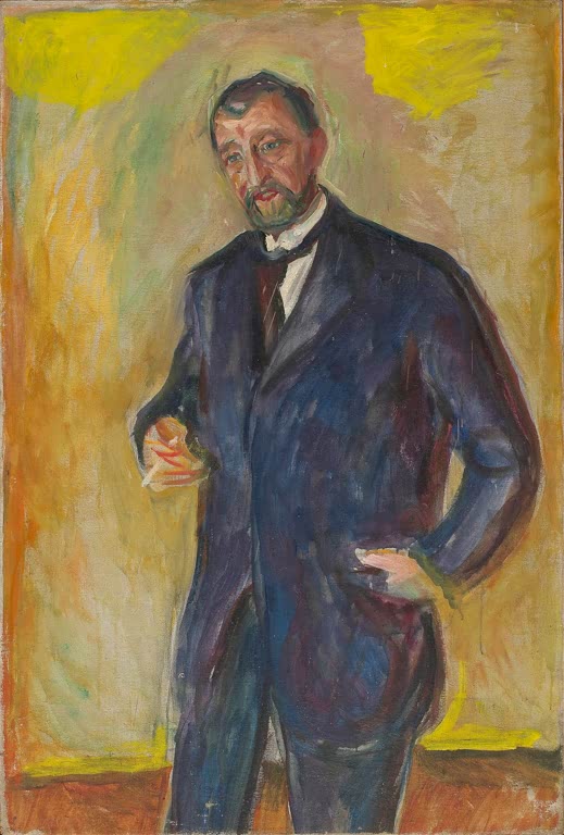 Bärtiger Mann im dunklen Anzug steht vor gelbem Hintergrund, eine Hand in der Hüfte – Edvard Munch Thorvald Løchen Kunstkopie