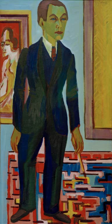 Stehender Mann im dunklen Anzug im Atelier mit Teppich – Ernst Ludwig Kirchner Stehender Maler. Selbstporträt Kunstkopie