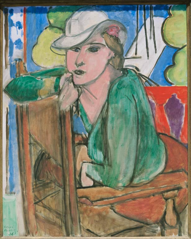 Frau mit weißem Hut und grüner Bluse, Arm auf Rohrstuhl gestützt – Henri Matisse La blouse verte Kunstkopie