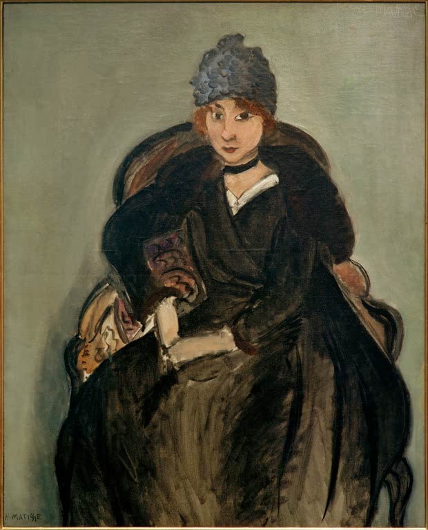 Frau mit blauer Mütze und dunklem Mantel im Sessel – Henri Matisse Marguerite à la toque bleue Kunstkopie