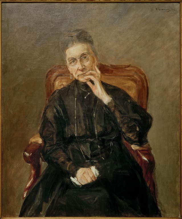 Ältere Frau in schwarzem Kleid sitzt im Lehnsessel, die Hand am Kinn – Max Liebermann Bildnis Bertha Biermann Kunstkopie