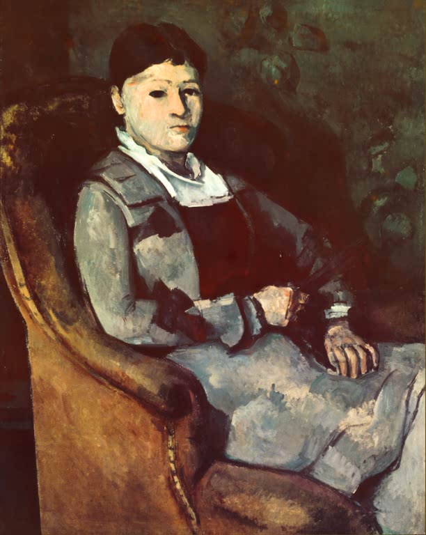 Frau in grauem Kleid sitzt im braunen Lehnstuhl, die Hände im Schoß – Paul Cézanne Madame Cézanne mit Fächer Kunstkopie