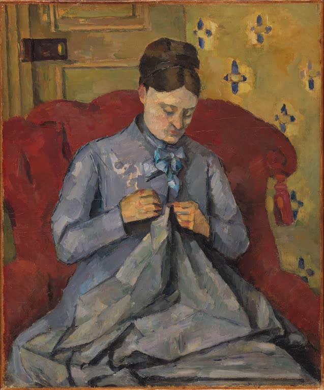 Nähende Frau in blauem Kleid im roten Sessel vor gelber Tapete – Paul Cézanne Porträt der Ehefrau des Künstlers Kunstkopie