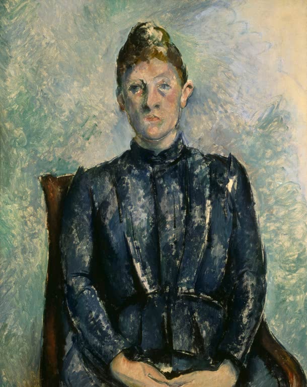 Frau in dunkelblauer Bluse sitzt aufrecht im Lehnstuhl vor grünem Grund – Paul Cézanne Portrait de Madame Cézanne Kunstkopie