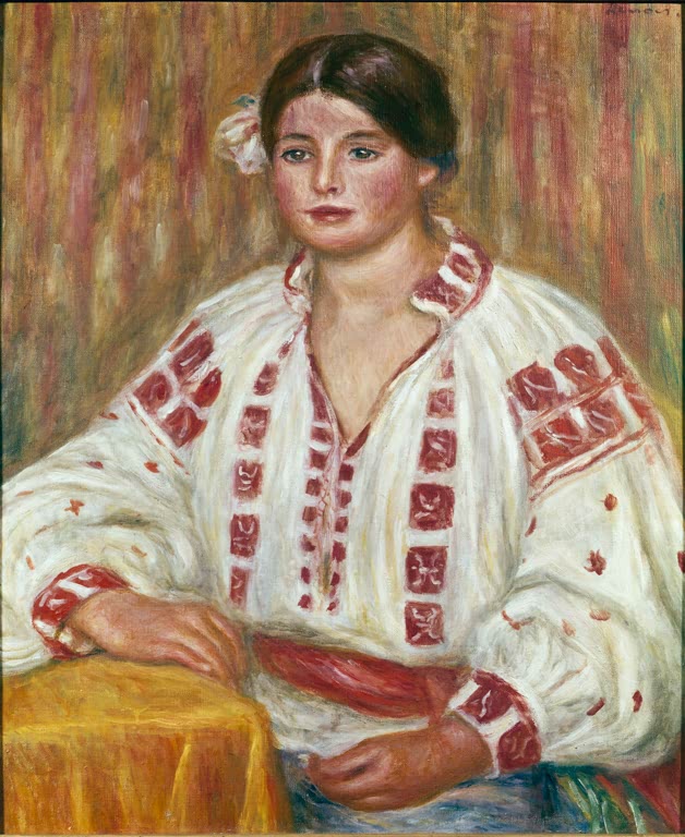 Frau in weißer Bluse mit roter Stickerei sitzt am Tisch – Pierre-Auguste Renoir Die bulgarische Bluse Kunstkopie